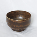 Brown ceramic bowl on a white background