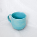 Blue ceramic mug on a white background